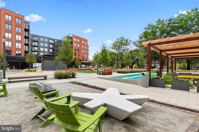 view of community with a patio area and a swimming pool