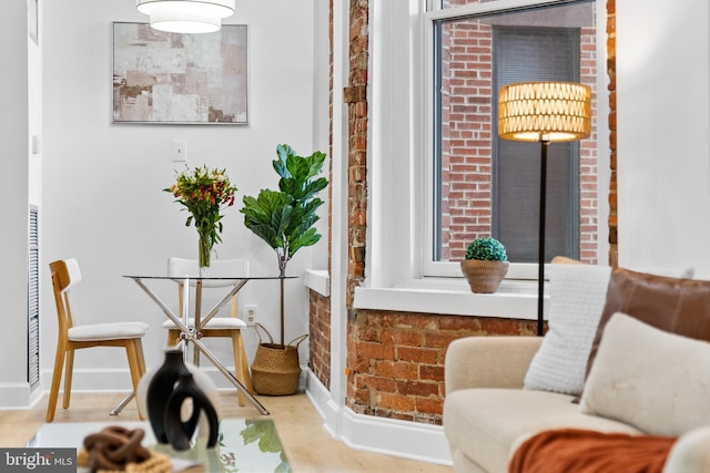 sitting room featuring wood finished floors and baseboards