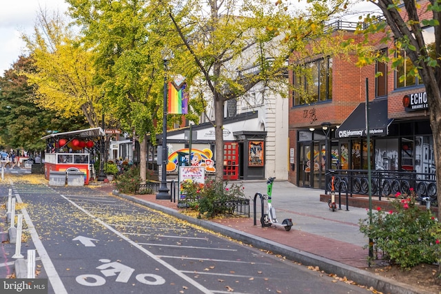 view of road with sidewalks and curbs