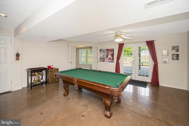 playroom with visible vents, baseboards, french doors, a textured ceiling, and concrete flooring