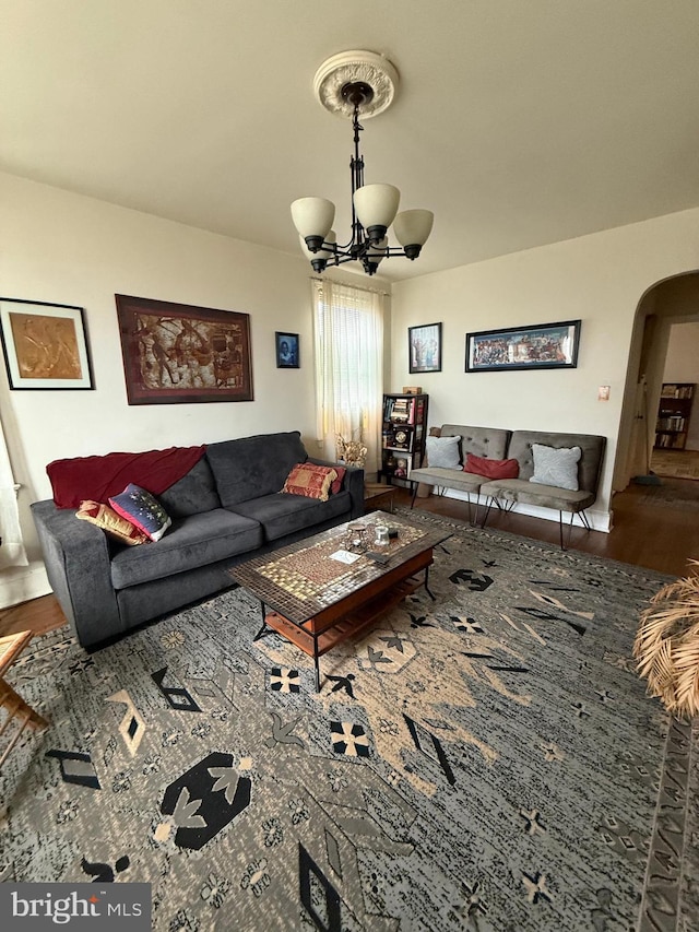 1301 Longfellow St NW Unit 310, Washington, DC 20011 - living area with an inviting chandelier, arched walkways, and wood finished floors