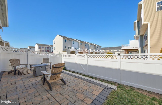 view of patio featuring a residential view and a fenced backyard