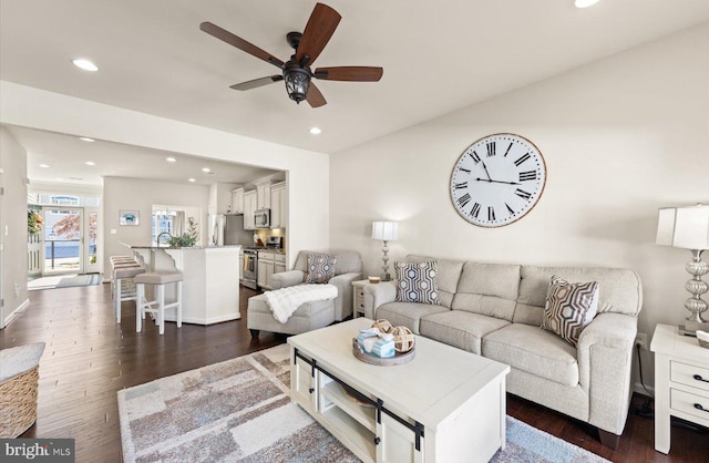 living area featuring ceiling fan, dark wood-style flooring, and recessed lighting