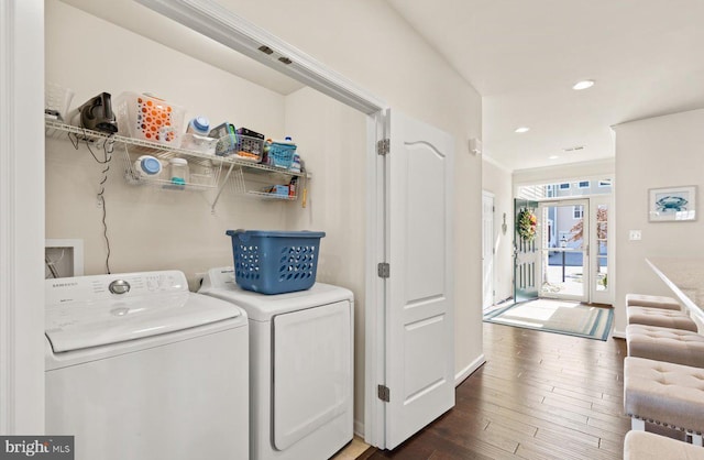 laundry area with washer and dryer, laundry area, recessed lighting, and wood finished floors