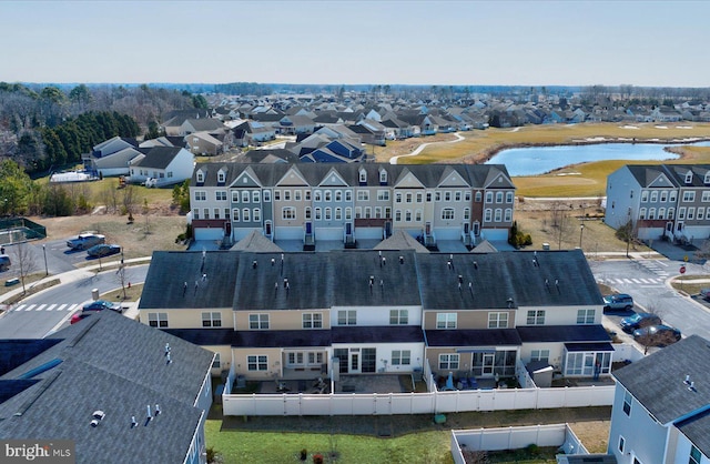 birds eye view of property with a water view and a residential view