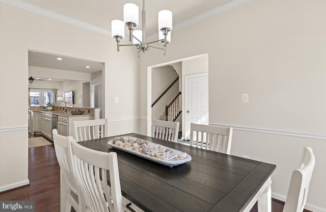 dining room featuring a notable chandelier, crown molding, stairs, and dark wood-type flooring