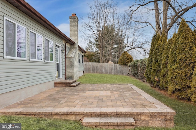 view of yard with a patio area and a fenced backyard