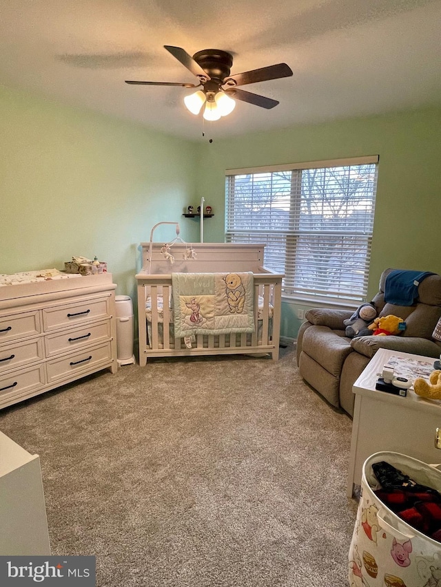 bedroom with carpet and a ceiling fan