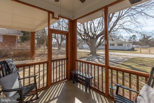 sunroom / solarium featuring ceiling fan