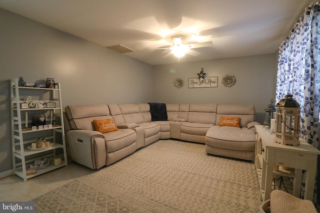 tiled living area with a ceiling fan