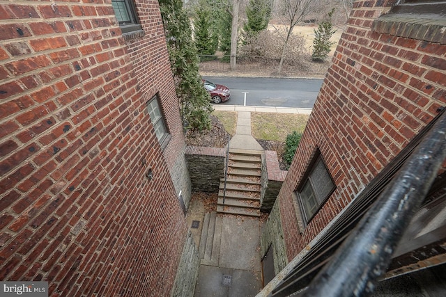 exterior space featuring brick siding