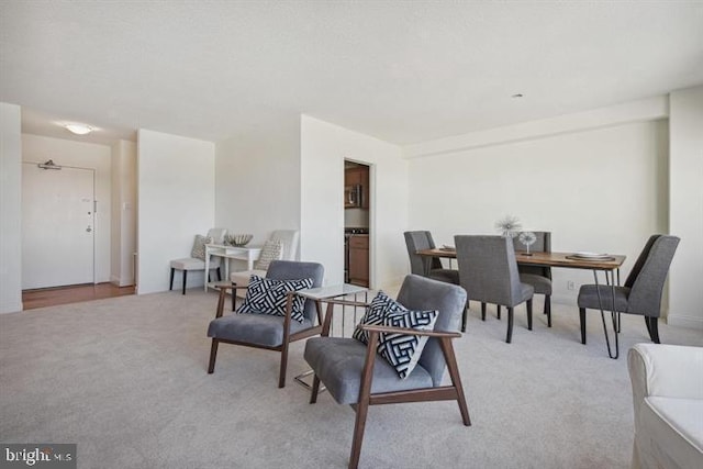 interior space featuring light colored carpet