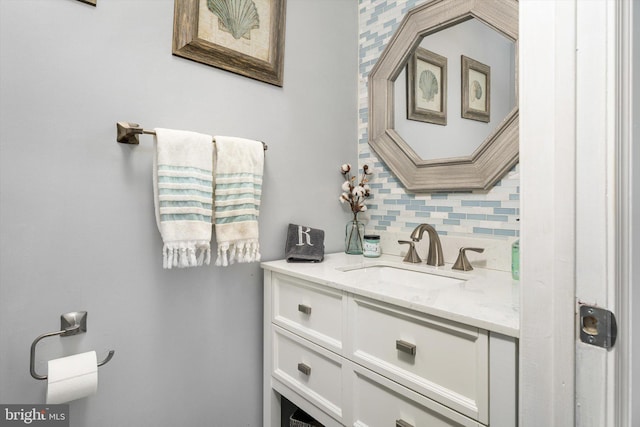 bathroom with vanity and decorative backsplash