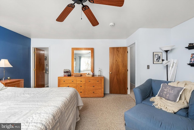 bedroom featuring ceiling fan and light colored carpet