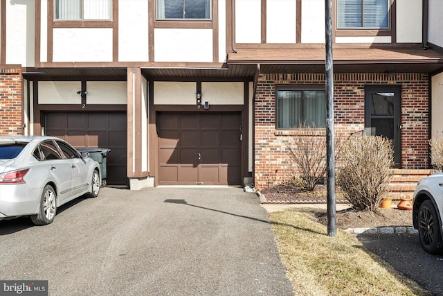 garage with aphalt driveway