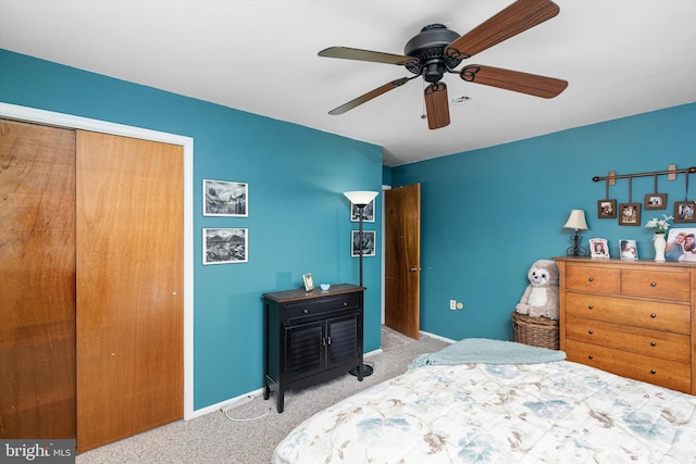 carpeted bedroom featuring a ceiling fan and baseboards