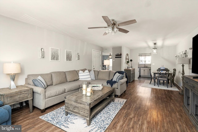 living room with ceiling fan and wood finished floors