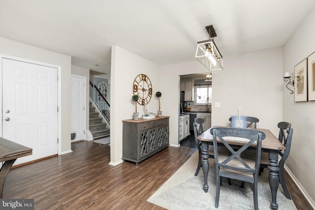 dining area featuring stairs, baseboards, and dark wood-type flooring