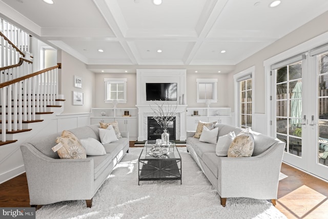 living room with french doors, beam ceiling, recessed lighting, stairway, and coffered ceiling