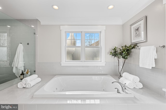 full bathroom with ornamental molding, recessed lighting, and a jetted tub