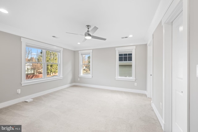 unfurnished bedroom with recessed lighting, light carpet, visible vents, and baseboards