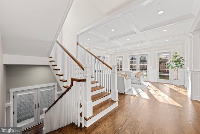 staircase featuring recessed lighting, coffered ceiling, wood finished floors, and french doors