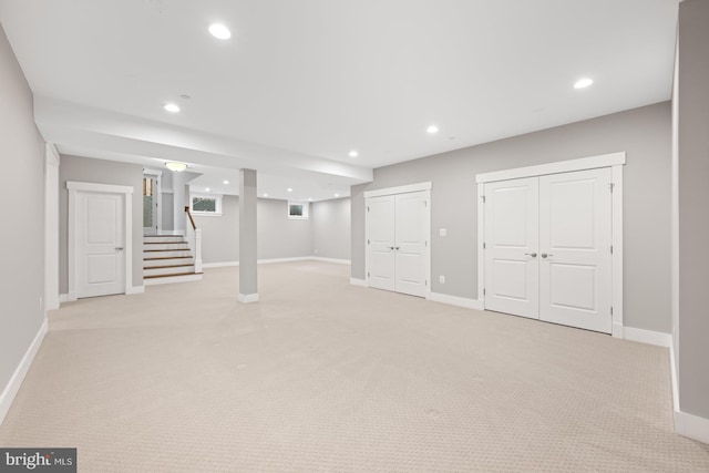 below grade area with baseboards, stairway, and recessed lighting