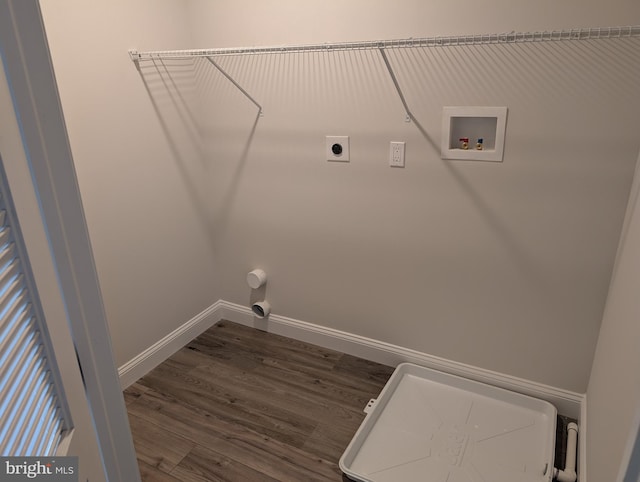 laundry room featuring hookup for a washing machine, baseboards, dark wood-style floors, electric dryer hookup, and laundry area