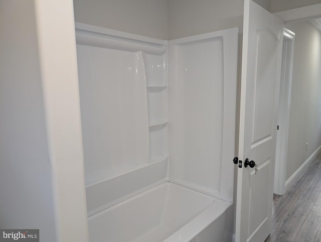 full bathroom with baseboards and wood finished floors