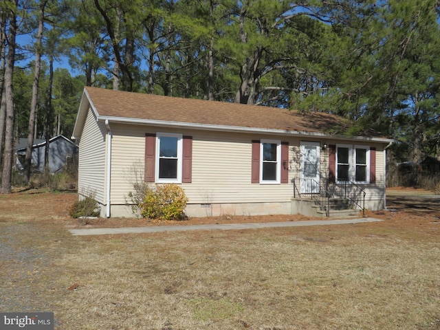 ranch-style home with crawl space and a front yard