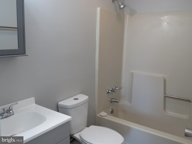 bathroom with toilet, vanity, and bathing tub / shower combination