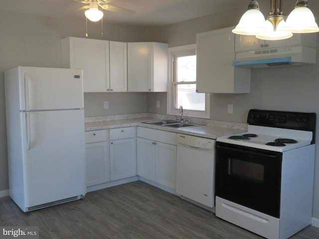 kitchen featuring white cabinetry, a sink, light wood-type flooring, white appliances, and under cabinet range hood