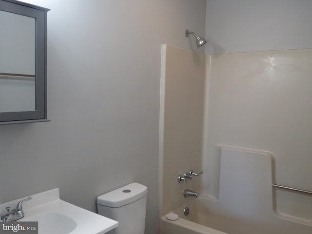 full bathroom featuring toilet, tub / shower combination, and vanity