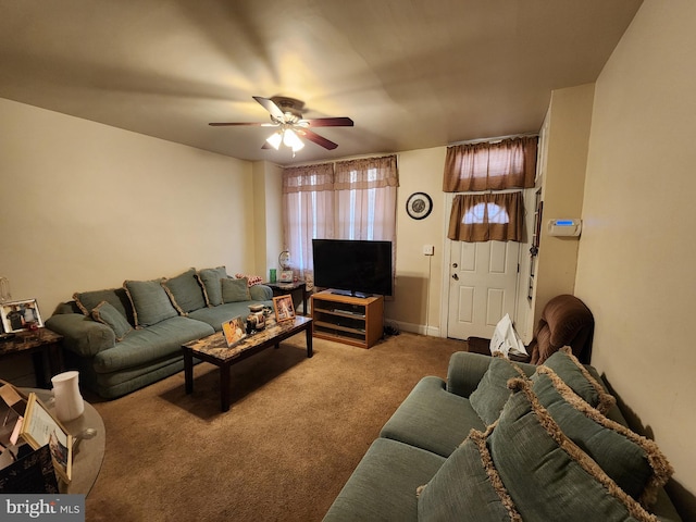 living area with carpet and a ceiling fan