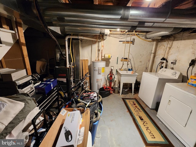 unfinished basement with washer and dryer, water heater, and a sink