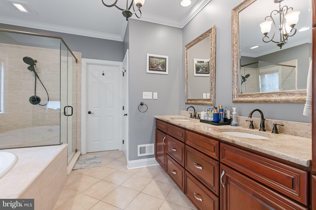 full bathroom featuring crown molding, visible vents, a sink, and a shower stall