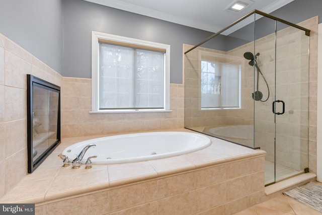 bathroom with a wealth of natural light, a shower stall, and tile patterned floors