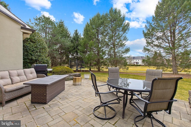 view of patio featuring outdoor dining area and an outdoor hangout area