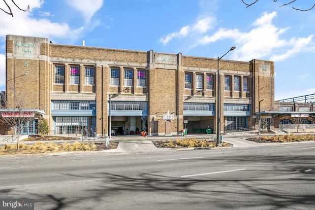 view of building exterior with concrete driveway