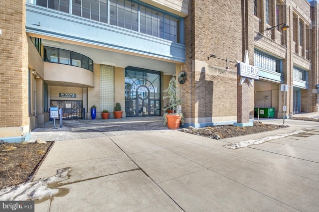 property entrance with brick siding