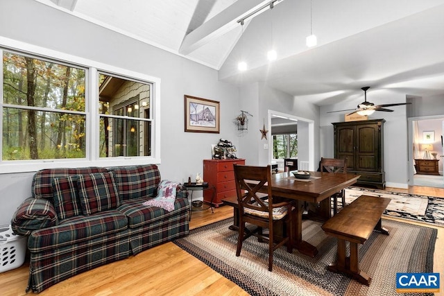 dining area with lofted ceiling, ceiling fan, and wood finished floors