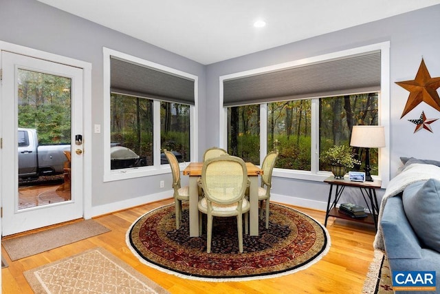 dining area featuring recessed lighting, baseboards, and wood finished floors