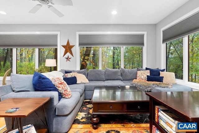 living room with a ceiling fan and recessed lighting