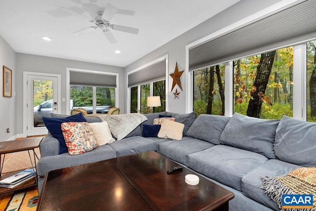 living area with a ceiling fan, recessed lighting, and plenty of natural light