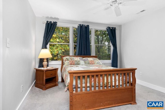 bedroom with a ceiling fan, carpet, visible vents, and baseboards