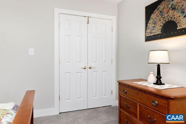 carpeted bedroom with a closet