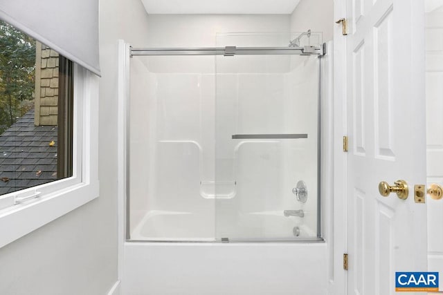 bathroom featuring enclosed tub / shower combo