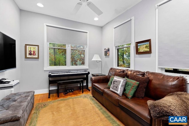 living room with ceiling fan, recessed lighting, wood finished floors, and baseboards