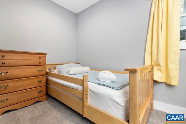 bedroom with light colored carpet