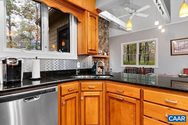 kitchen featuring stainless steel dishwasher, decorative backsplash, a sink, and brown cabinets